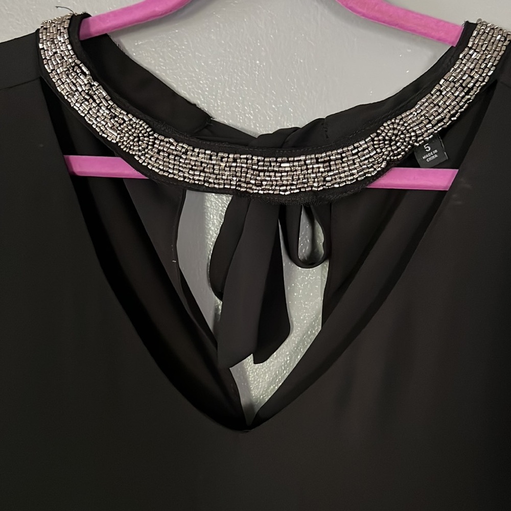 Torrid black flowy top, cut out v neck and tie neck size 5